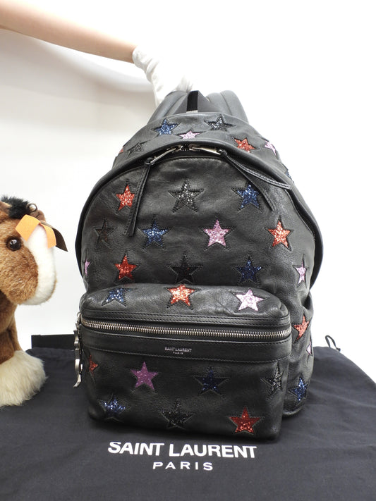 Zaino Saint Laurent City YSL in pelle glitterata con stelle, nero, usato ma in ottime condizioni @LY454319-1016