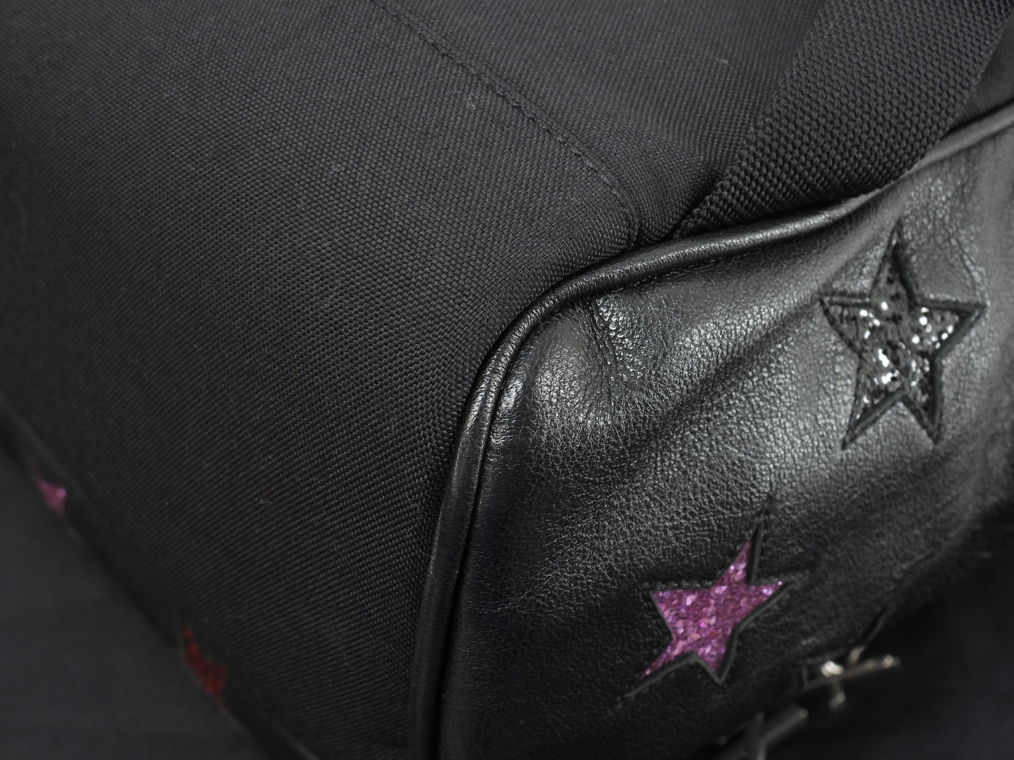 Zaino Saint Laurent City YSL in pelle glitterata con stelle, nero, usato ma in ottime condizioni @LY454319-1016