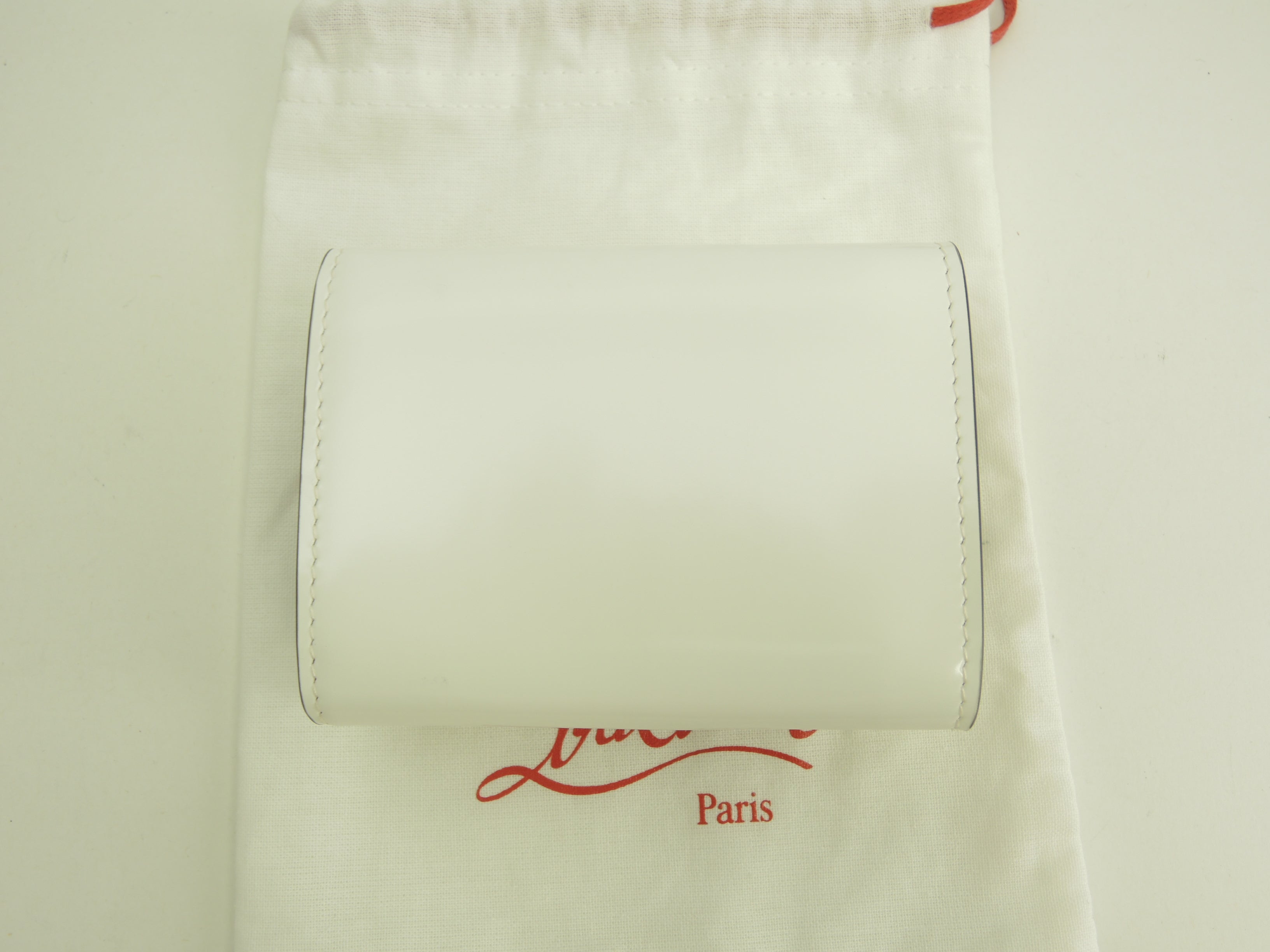 Christian Louboutin portafoglio mini a 3 ante Loubi54 pelle verniciata bianca portafoglio compatto inutilizzato @ 2