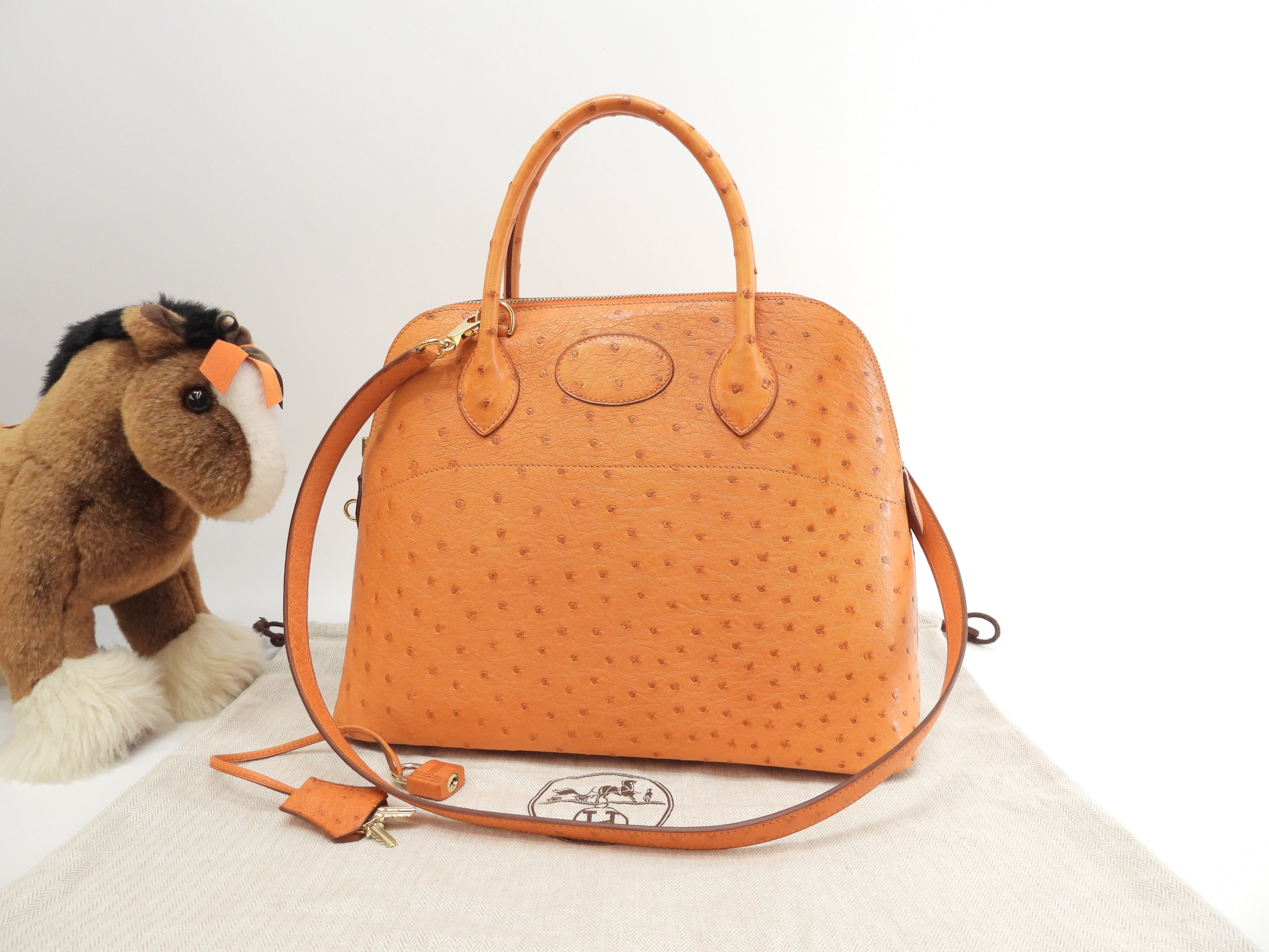 Hermes Bolide 31 Struzzo arancione metalleria oro con tracolla borsa a mano usato in condizioni eccellenti @□F
