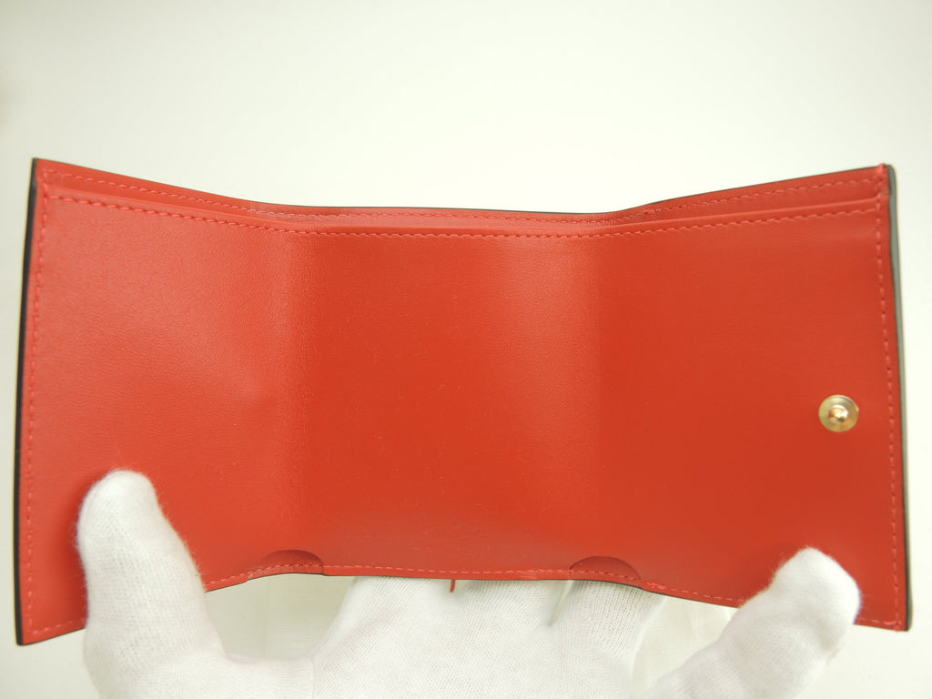 Christian Louboutin, mini portafoglio a tre ante Loubi54 in pelle verniciata rossa, portafoglio compatto, mai usato @ 1