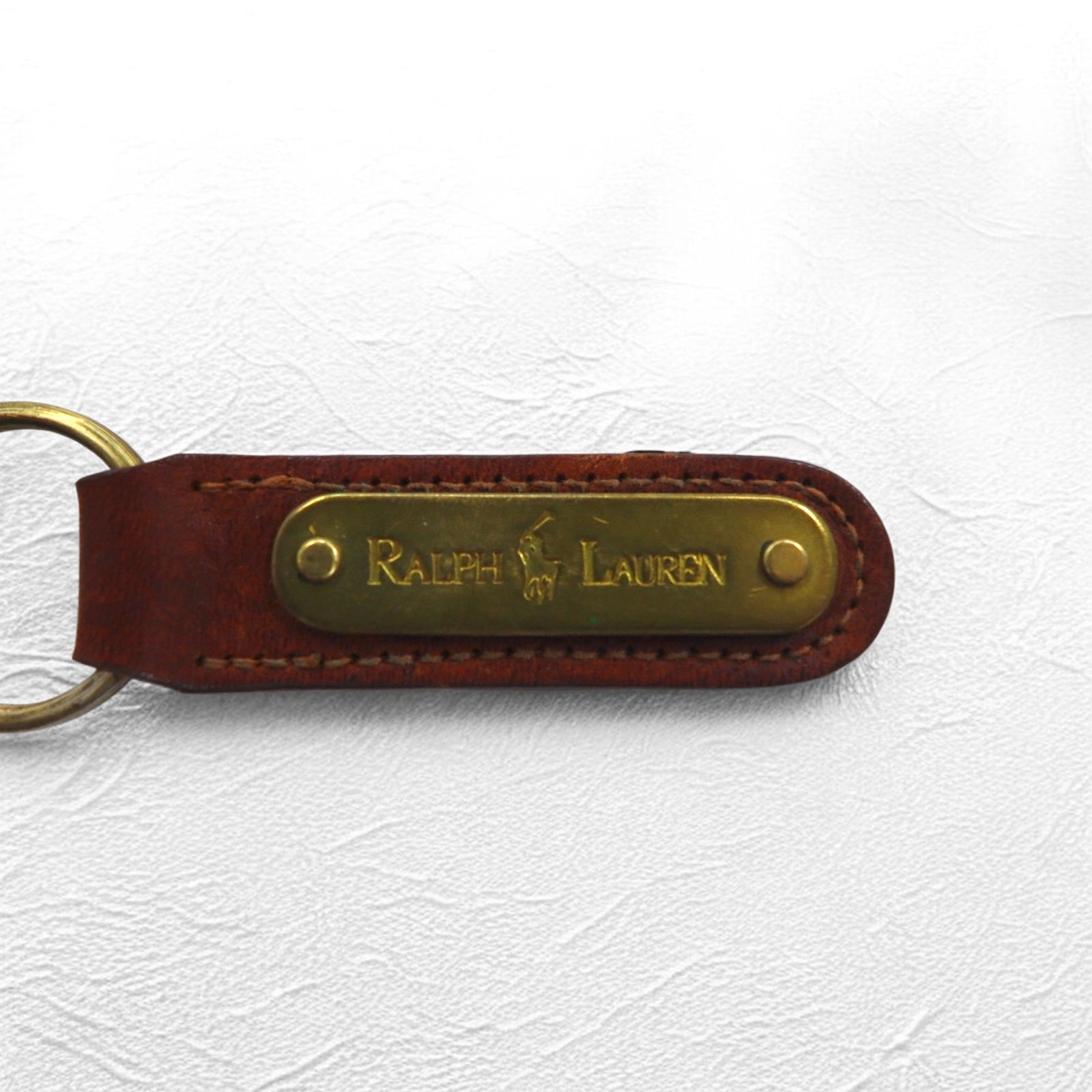 RALPH LAUREN USA Portachiavi in pelle marrone con placca in metallo, mai usato