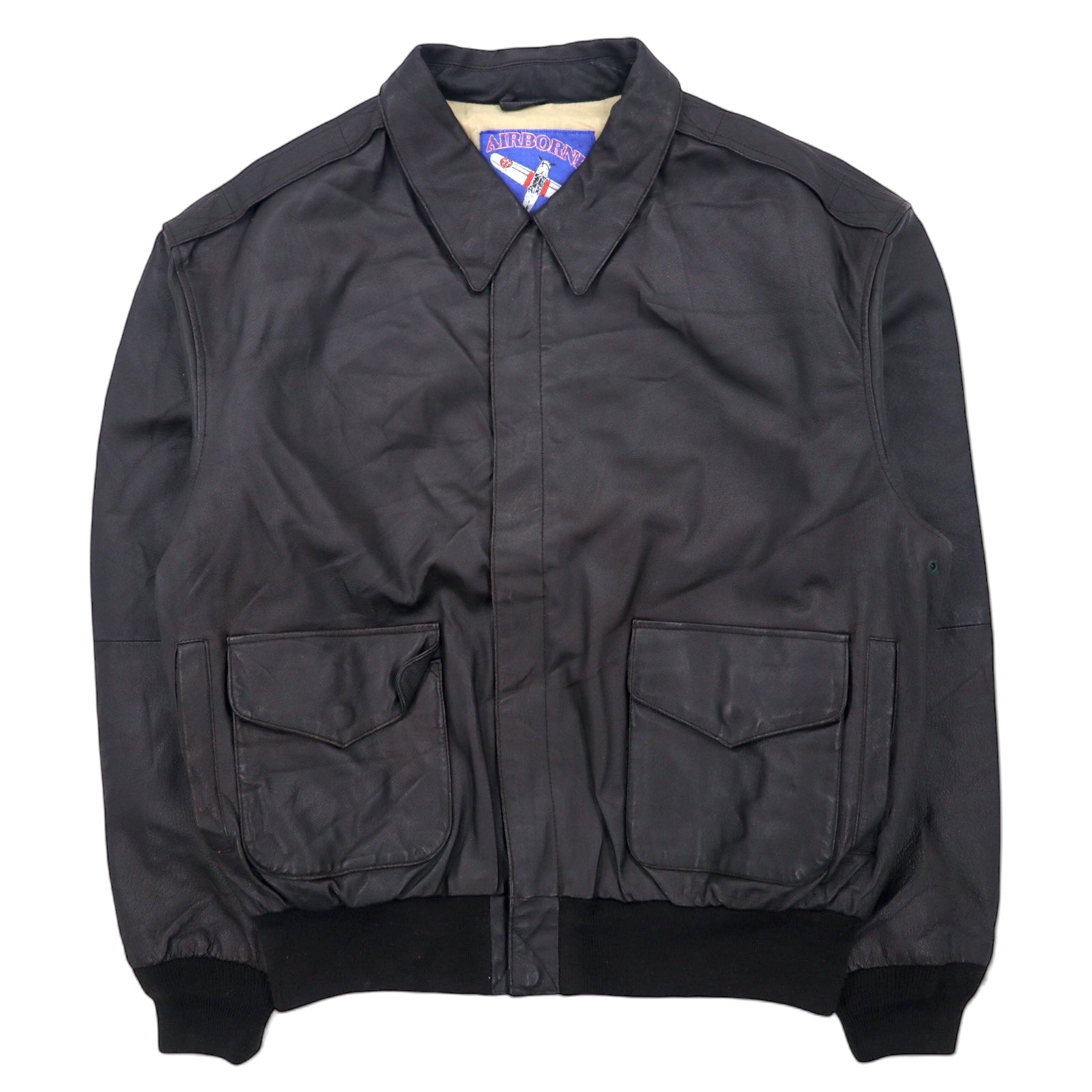 Giacca da aviatore AIRBORNE in pelle A-2 L marrone con bandiera americana