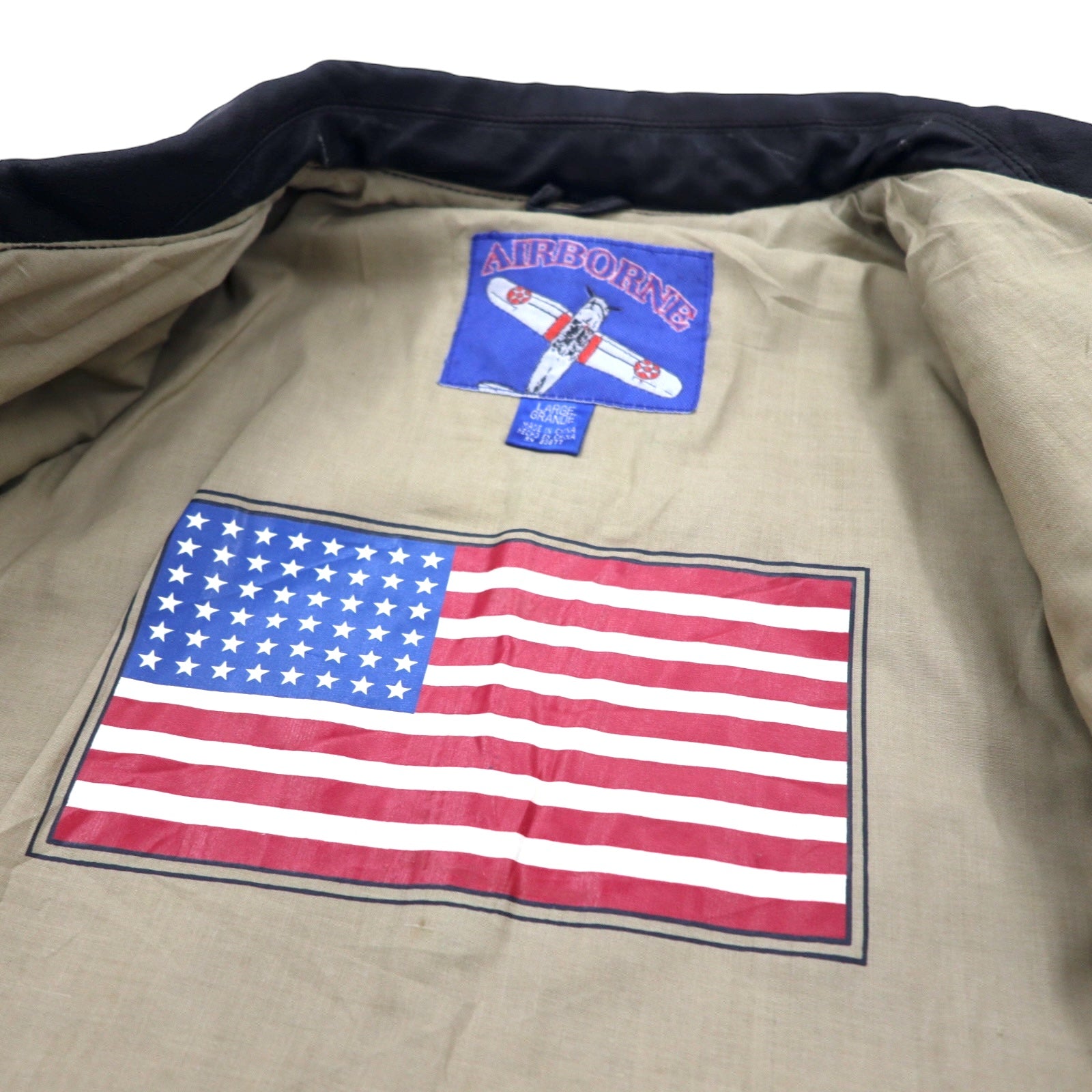 Giacca da aviatore AIRBORNE in pelle A-2 L marrone con bandiera americana