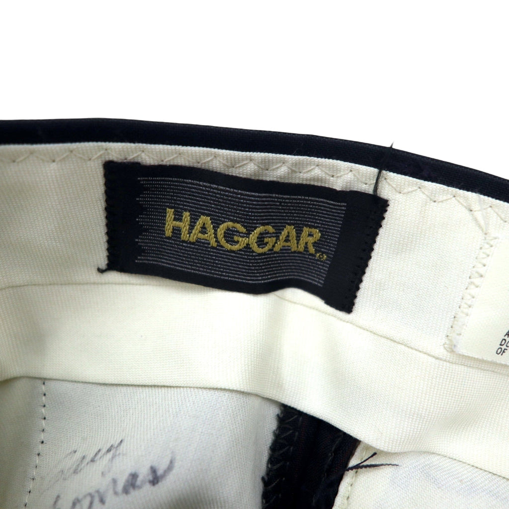 Pantaloni eleganti HAGGAR anni '90, taglia 33, neri a righe, poliestere, realizzati nella Repubblica Dominicana (USA)