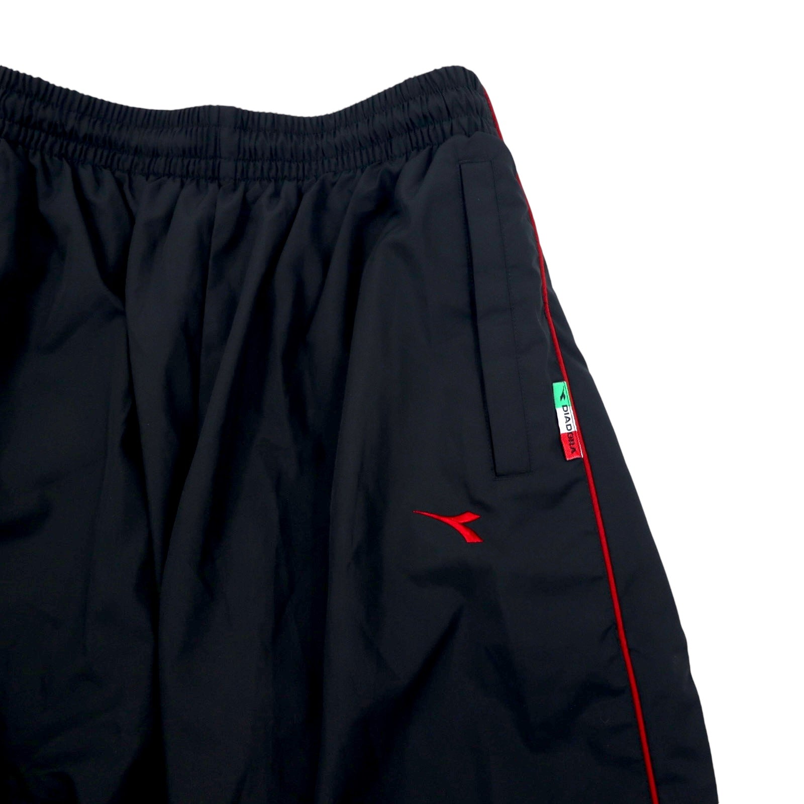 DIADORA anni '90, pantaloni della tuta, taglia L, neri, poliestere, spacchi laterali, bottoni a pressione, fodera in mesh