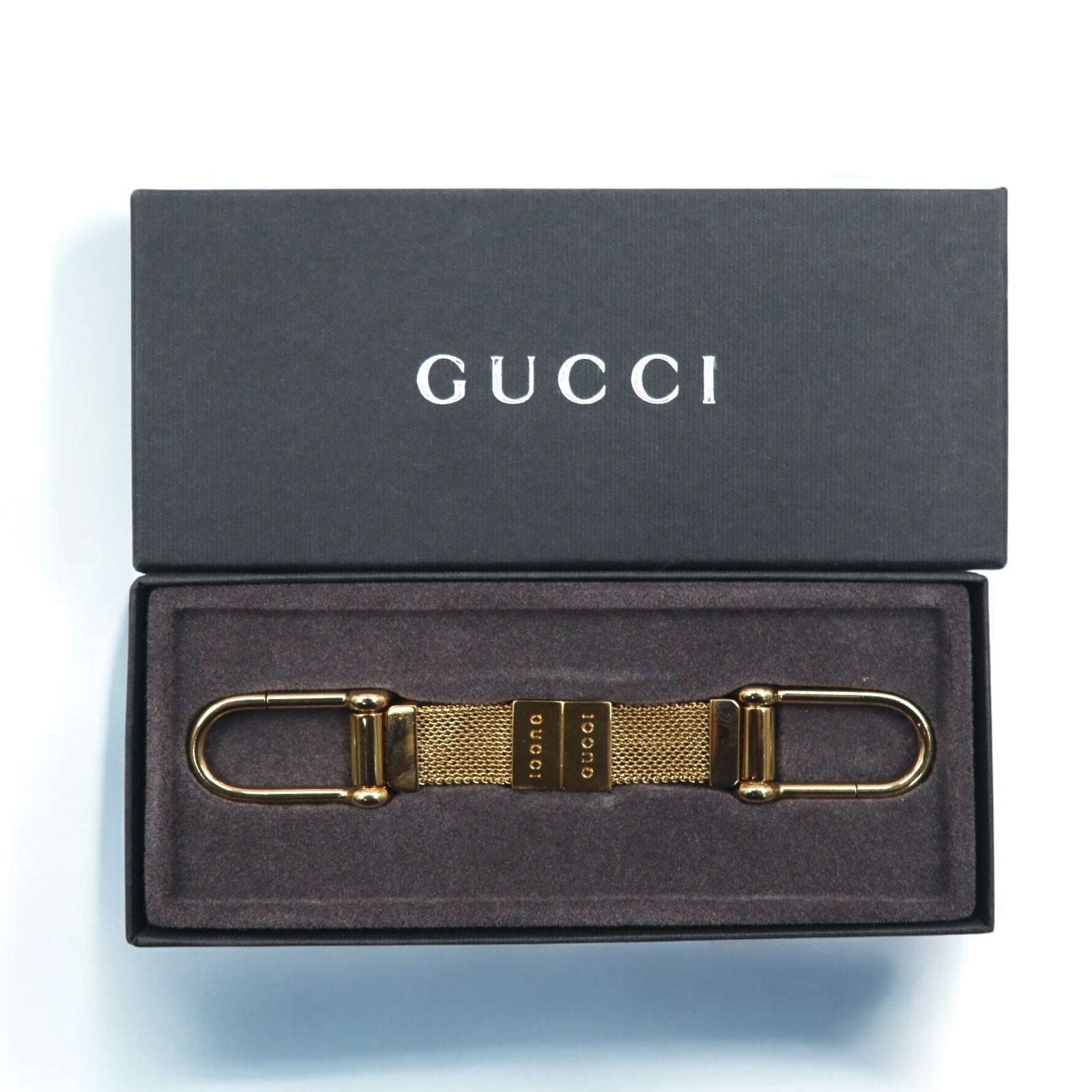 GUCCI Portachiavi a sezione in maglia di metallo dorato Fabbricato in Italia