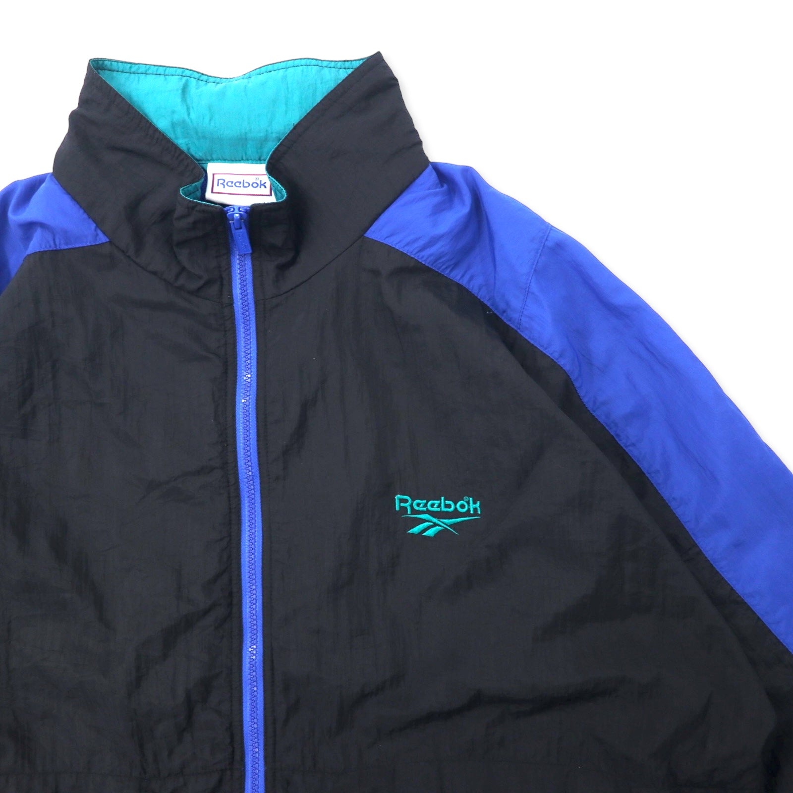 Reebok giacca in nylon anni '90, taglia XL, nero e blu, logo vettoriale, cappuccio ripiegabile