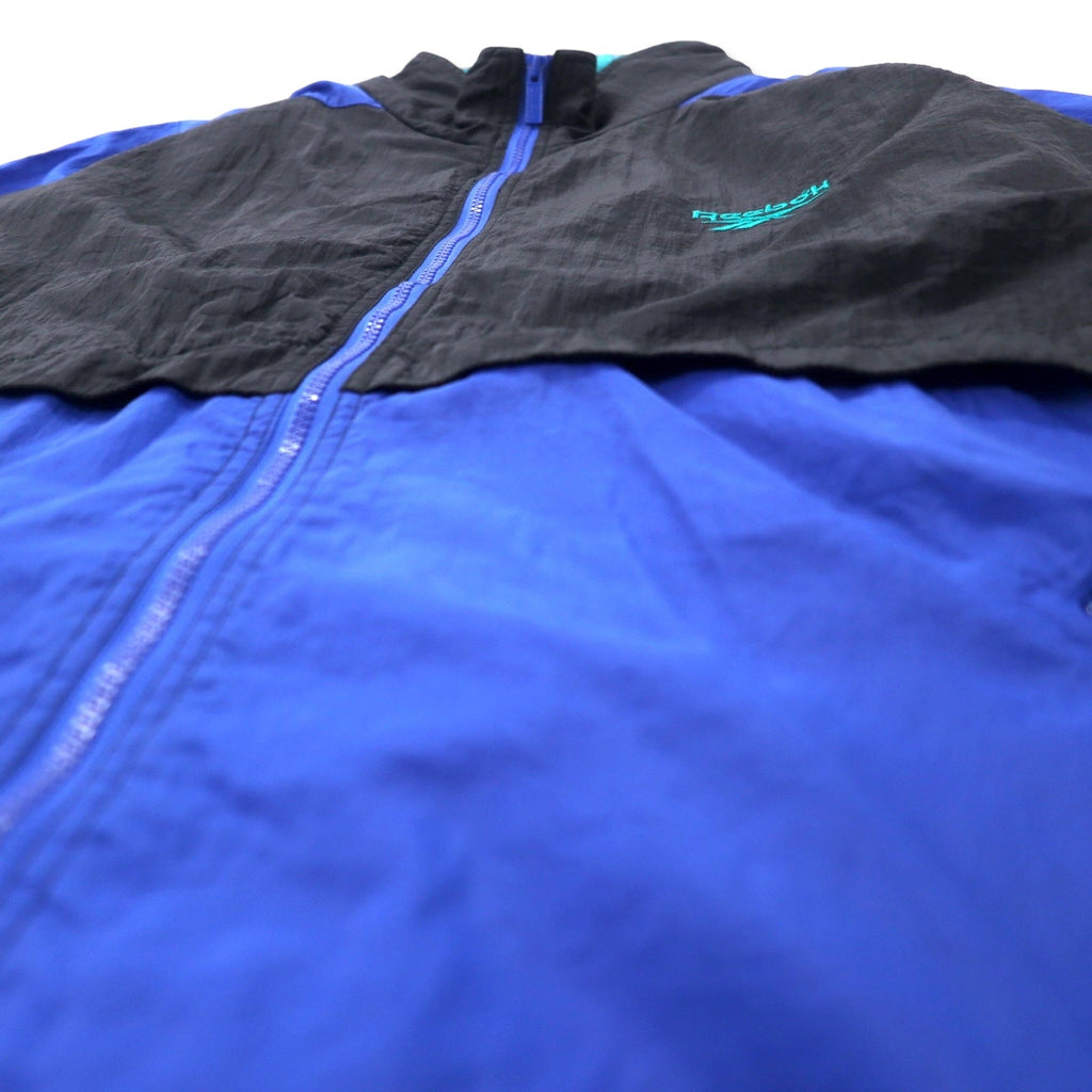 Reebok giacca in nylon anni '90, taglia XL, nero e blu, logo vettoriale, cappuccio ripiegabile