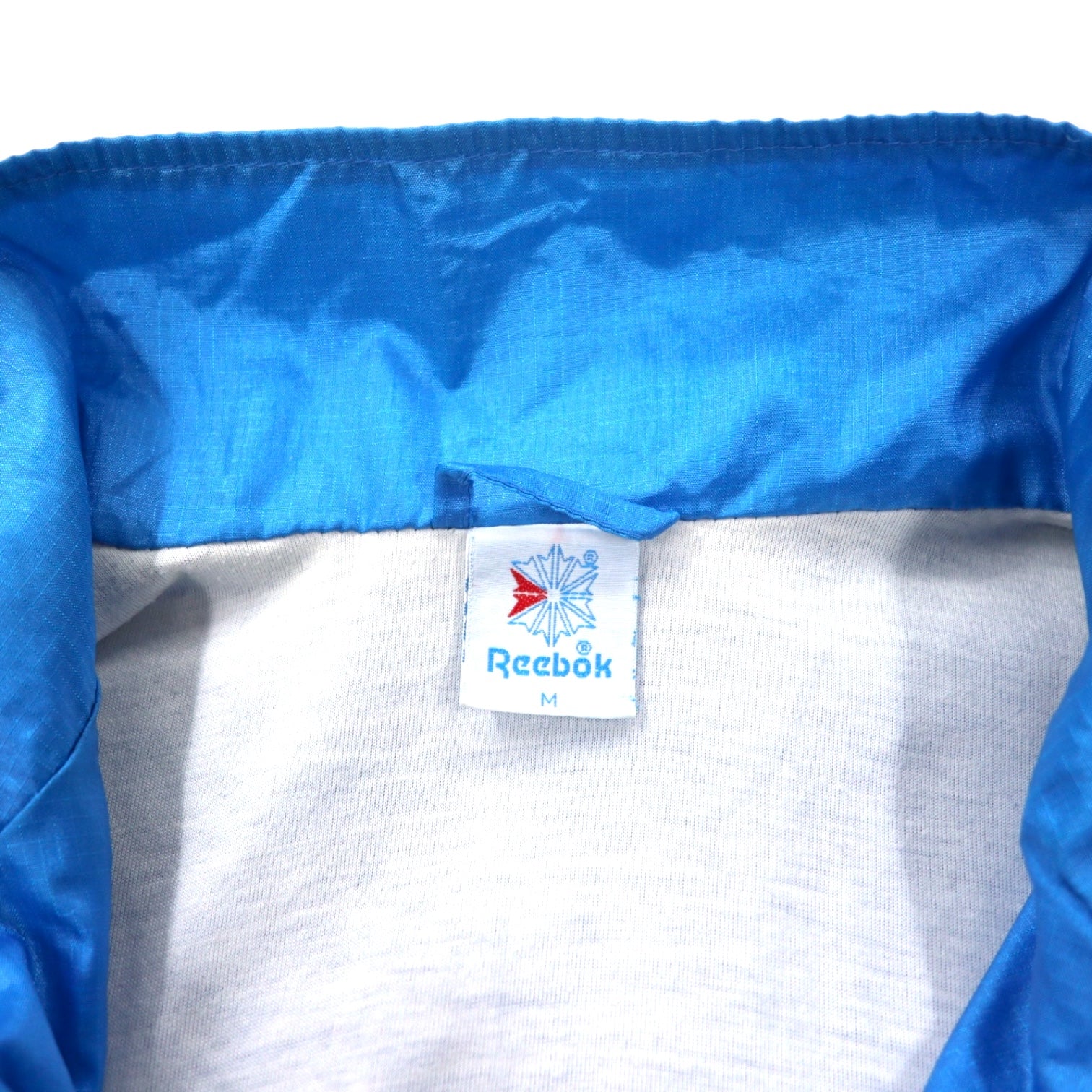 Reebok anni '90 Giacca in nylon Tuta M Blu Poliestere Logo ricamato sulla schiena