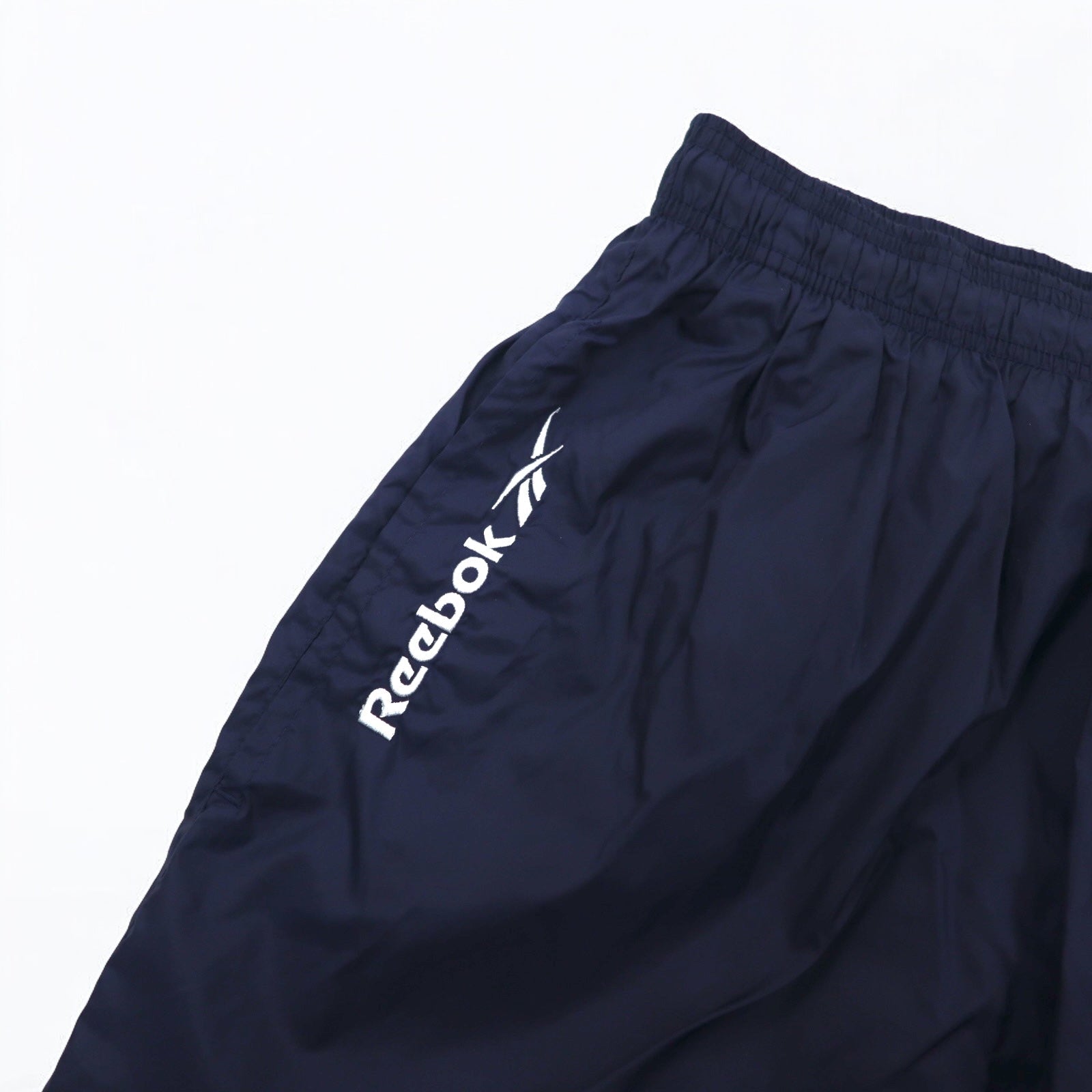 Reebok Anni '90 Pantaloni della tuta in nylon Tuta L Blu navy Logo Vector ricamato Spacco Cerniera sull'orlo