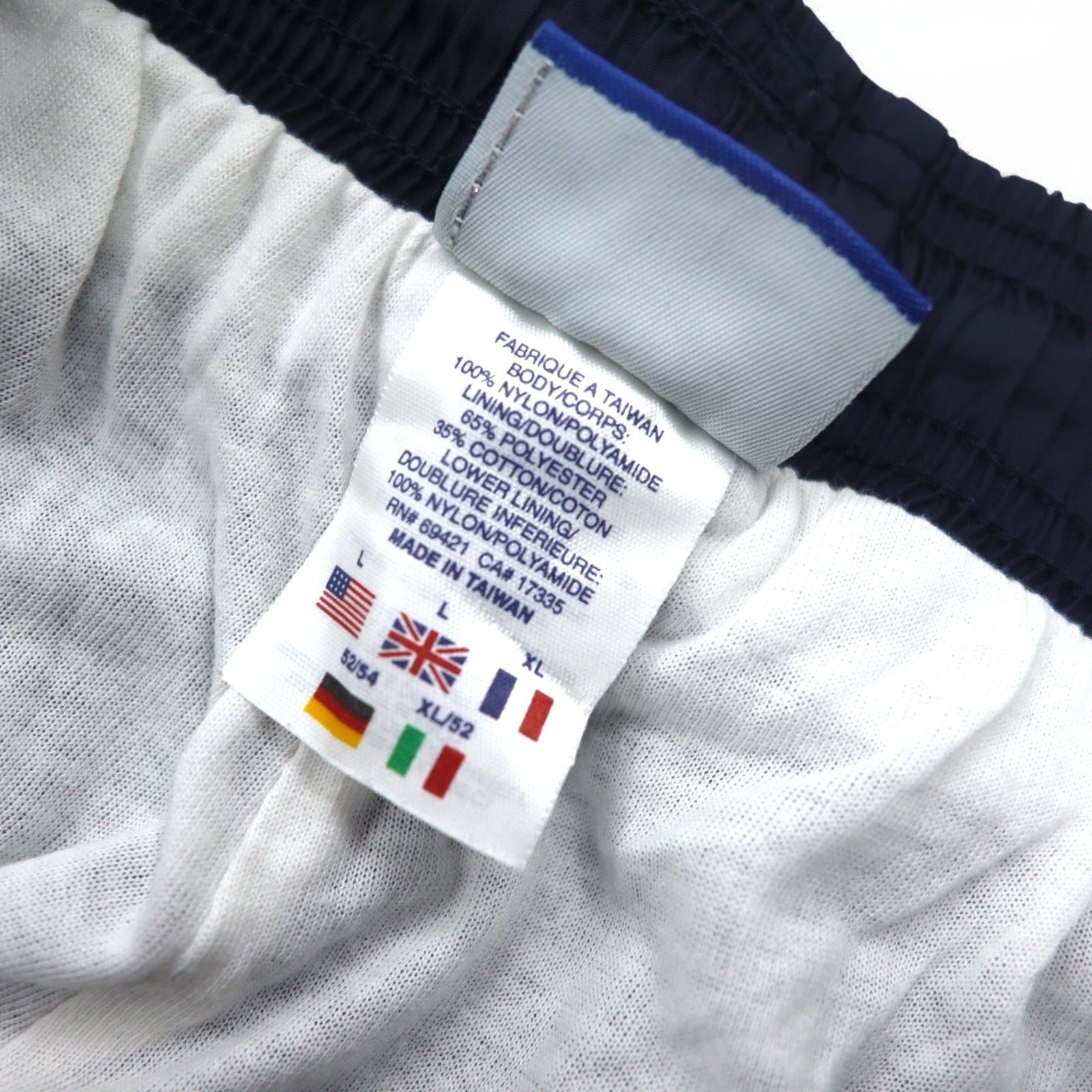 Reebok Anni '90 Pantaloni della tuta in nylon Tuta L Blu navy Logo Vector ricamato Spacco Cerniera sull'orlo