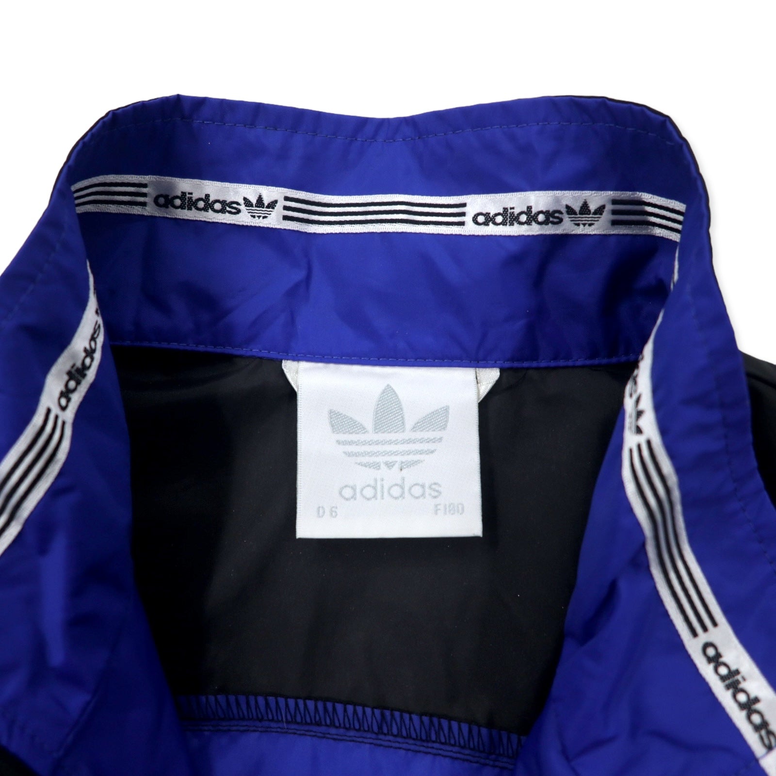 Giacca a vento Adidas anni '90, nylon, blu, nero, coulisse, etichetta argento, logo Trifoglio, oversize