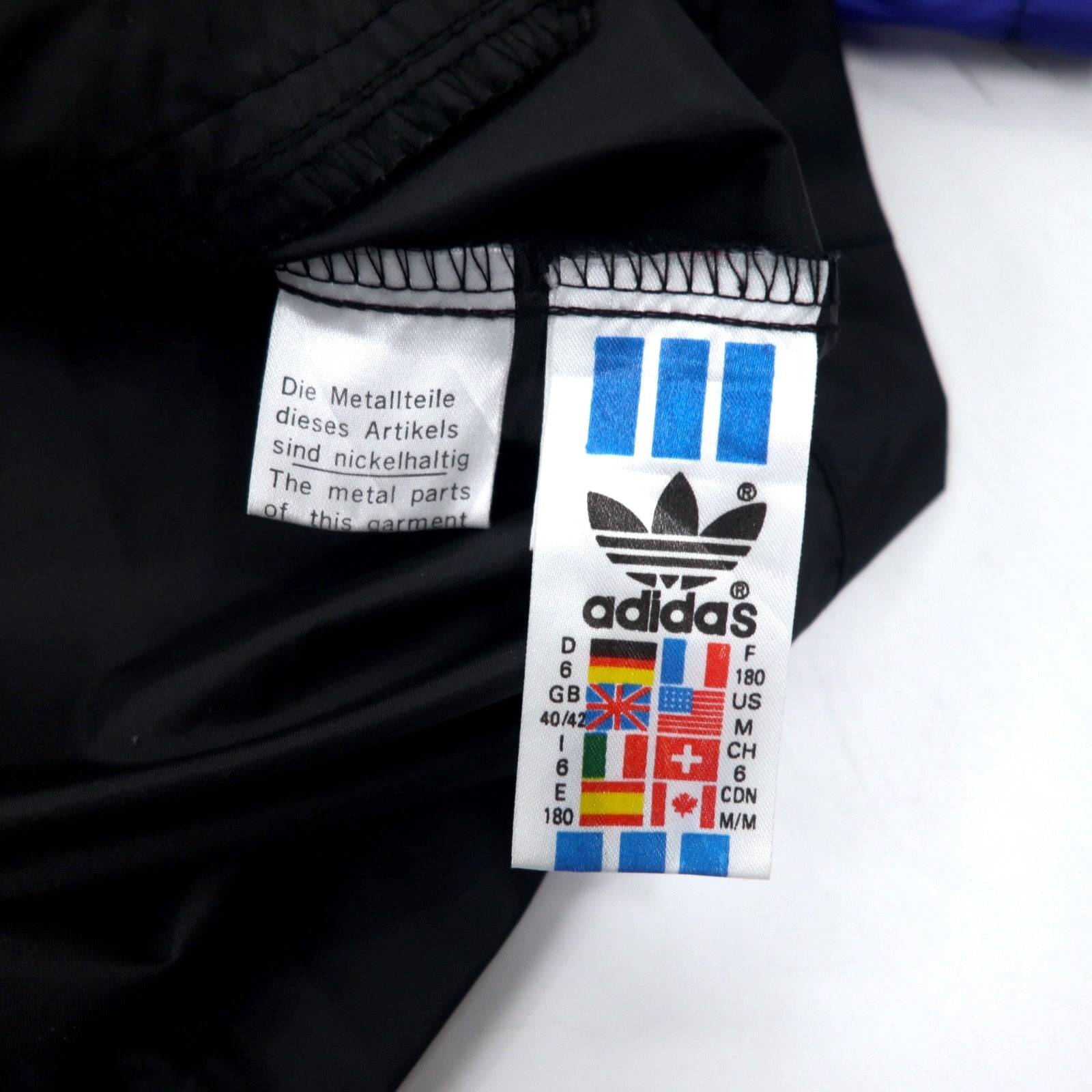 Giacca a vento Adidas anni '90, nylon, blu, nero, coulisse, etichetta argento, logo Trifoglio, oversize