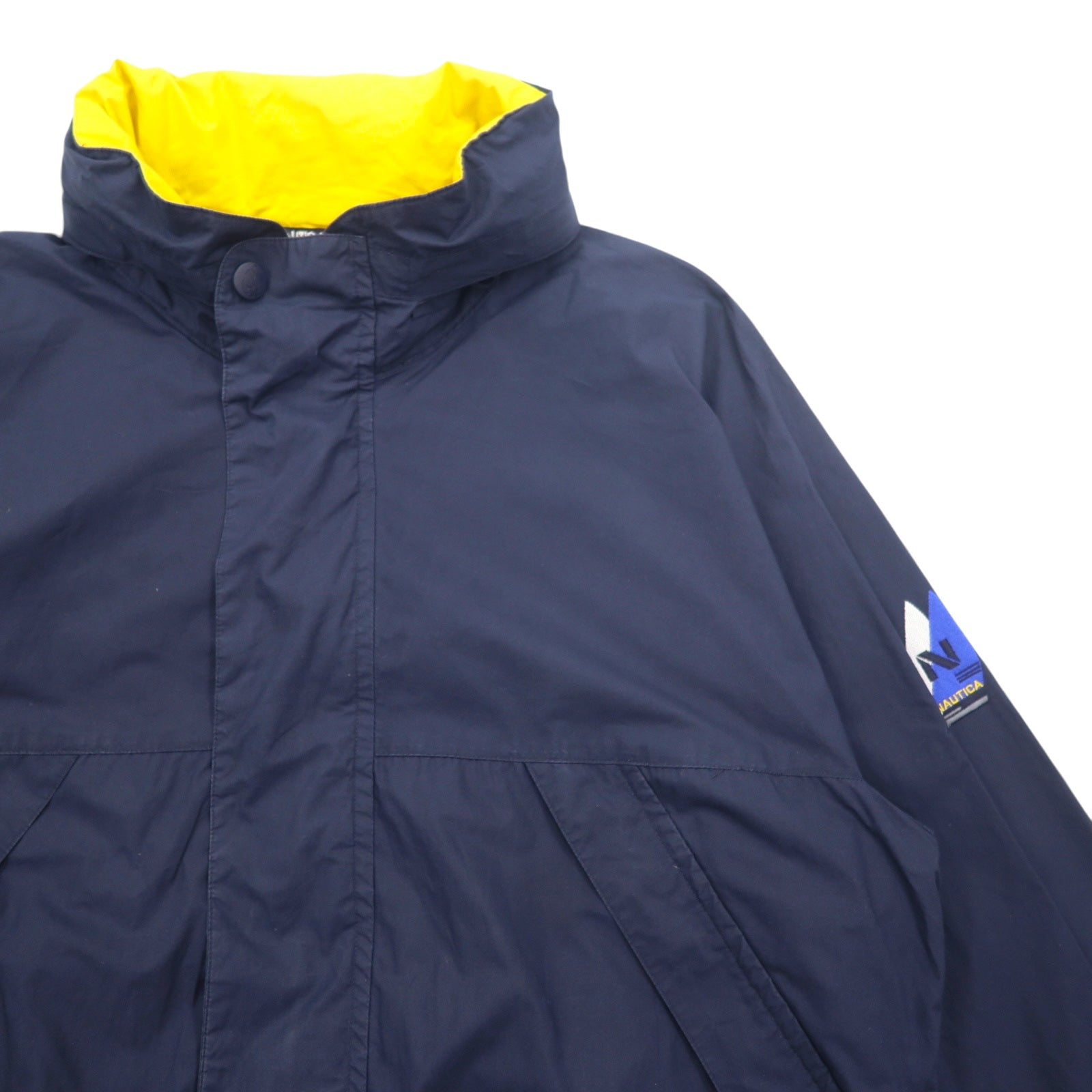 Giacca a vela Nautica anni '90, giacca a vento in nylon, taglia XL, blu navy, cotone, cappuccio a scomparsa, logo ricamato.