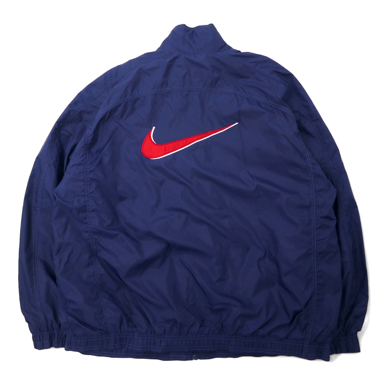 NIKE Giacca in nylon anni '90, taglia XL, blu navy, logo posteriore, logo Swoosh, etichetta argentata, oversize.