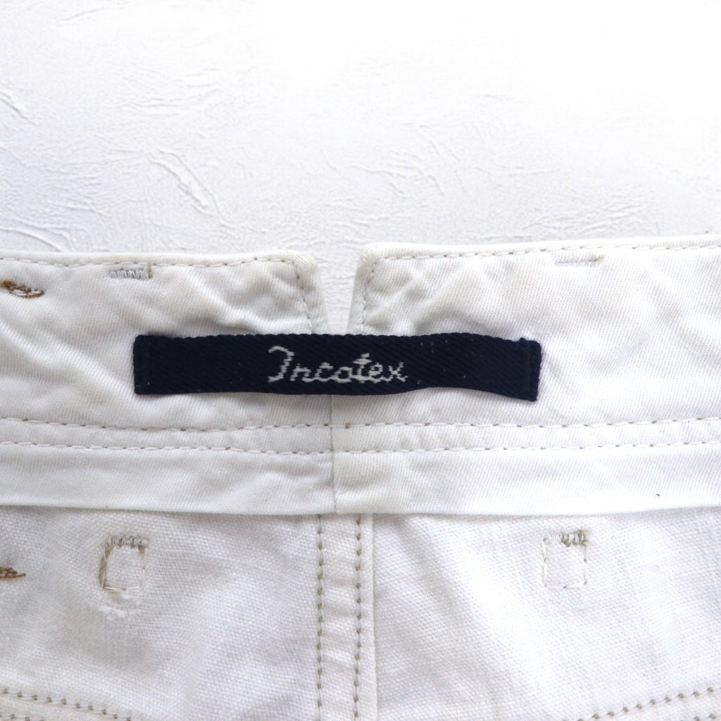 INCOTEX jeans dalla Romania, taglia M, bianchi, in cotone, modello TOMM SLIM, con patch in pelle e chiusura a zip.