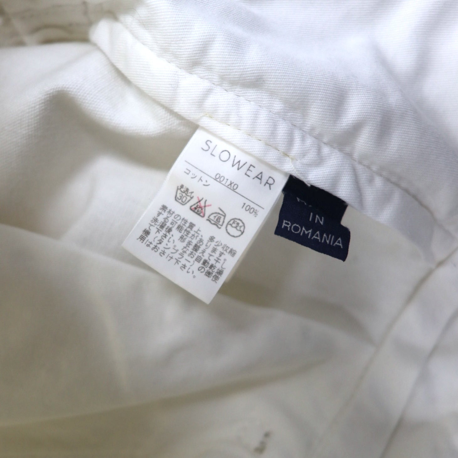 INCOTEX jeans dalla Romania, taglia M, bianchi, in cotone, modello TOMM SLIM, con patch in pelle e chiusura a zip.