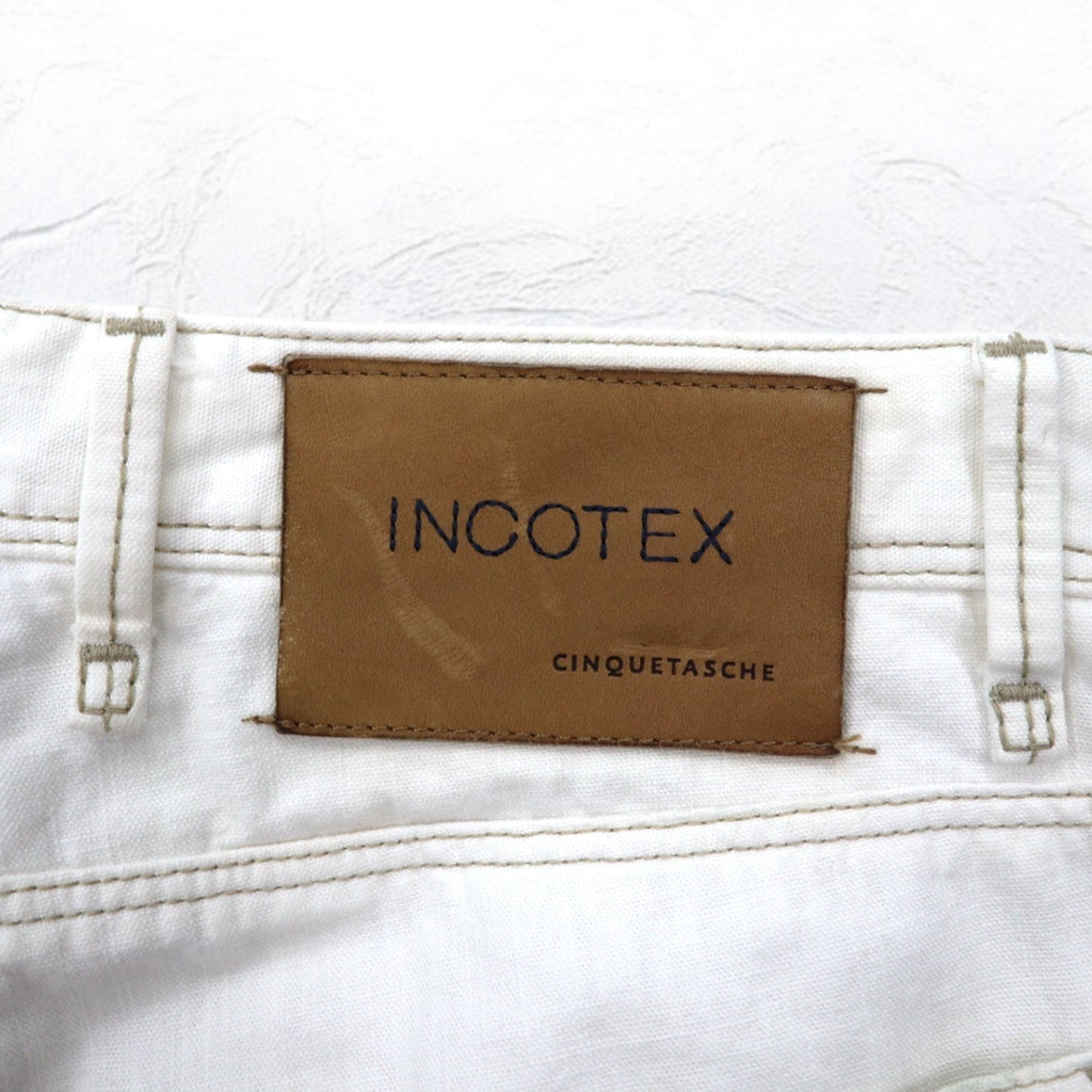 INCOTEX jeans dalla Romania, taglia M, bianchi, in cotone, modello TOMM SLIM, con patch in pelle e chiusura a zip.