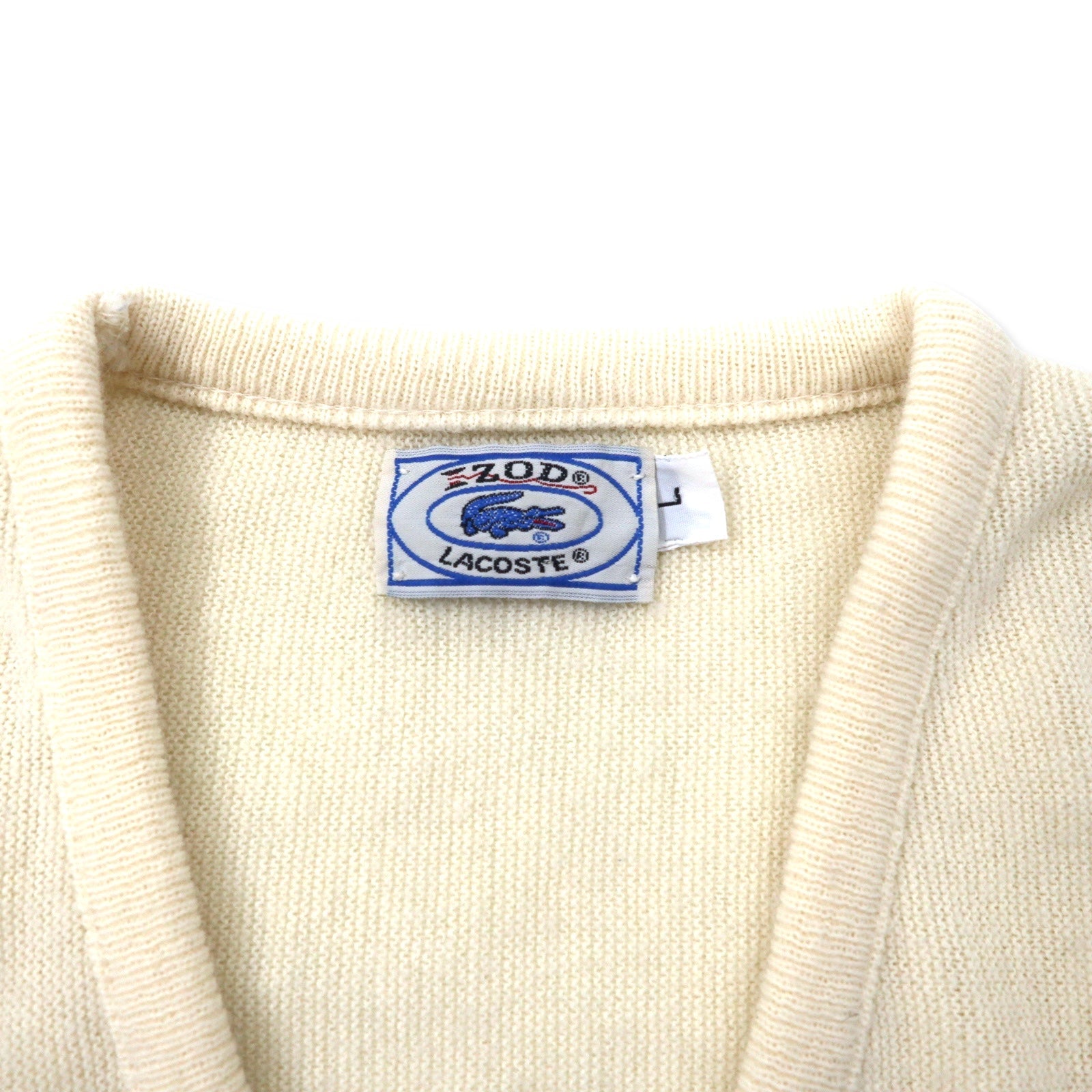 IZOD LACOSTE anni '70 maglione in acrilico scollo a V, etichetta "filo avvolto", taglia L, bianco, logo ricamato.