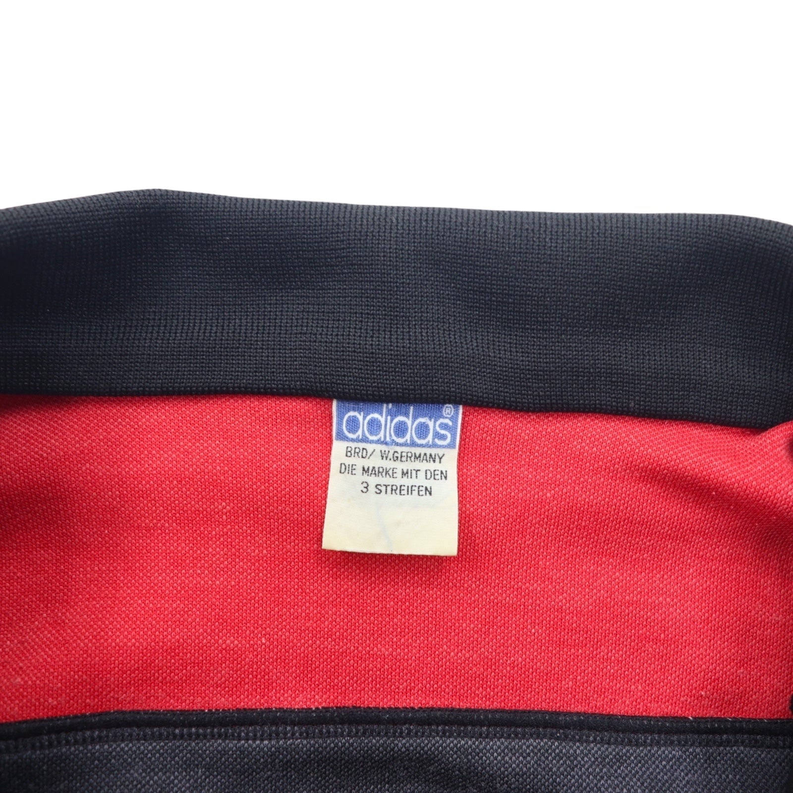adidas, made in Germania Ovest, anni '70, giacca sportiva, tuta, taglia L, rosso e nero, poliestere, logo trifoglio, prodotta da Descente.