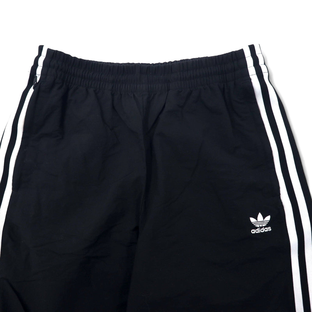 adidas originals Pantaloni da tuta XOT neri in nylon con logo a trifoglio 3 strisce LOCK UP TRACK PANTS ED7542