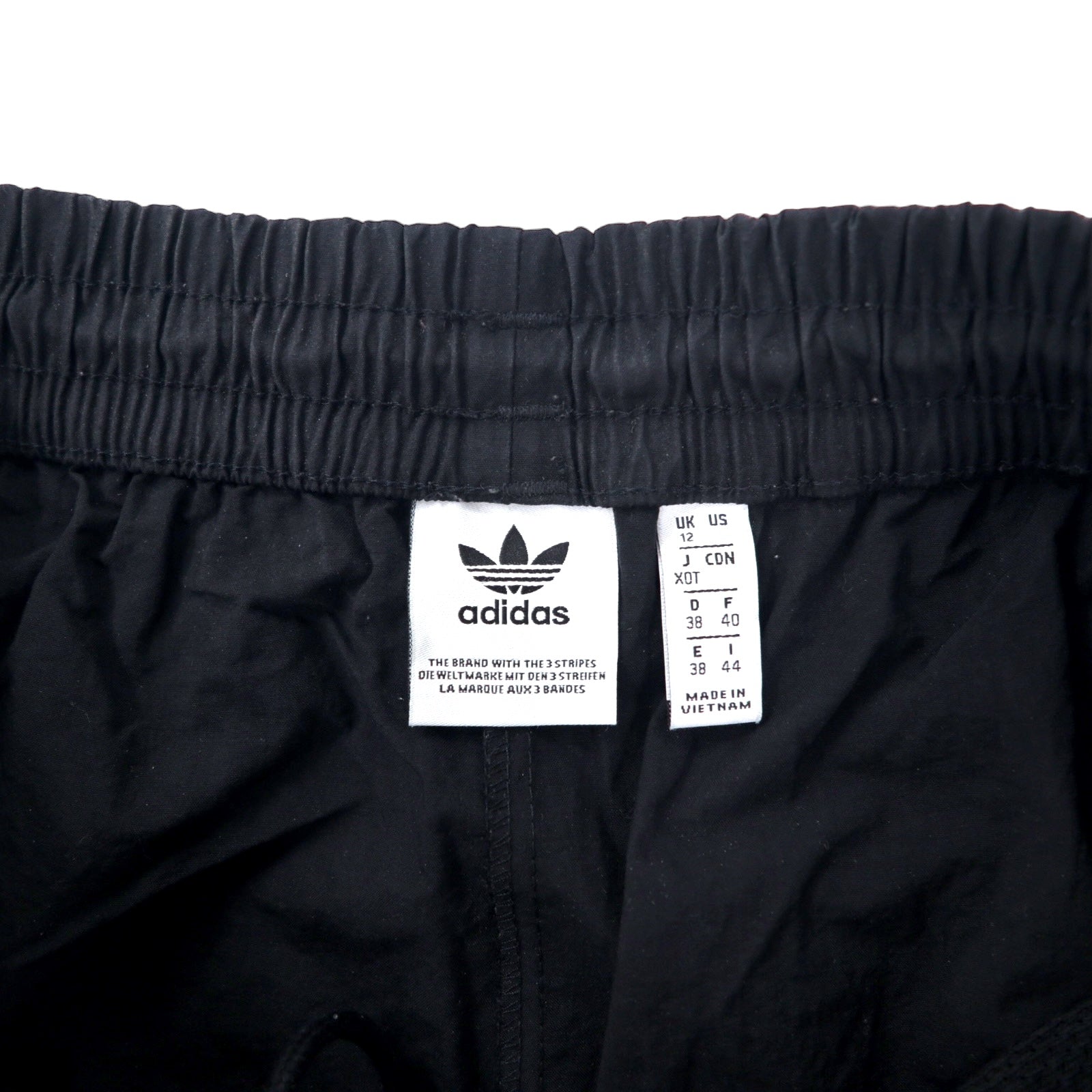 adidas originals Pantaloni da tuta XOT neri in nylon con logo a trifoglio 3 strisce LOCK UP TRACK PANTS ED7542