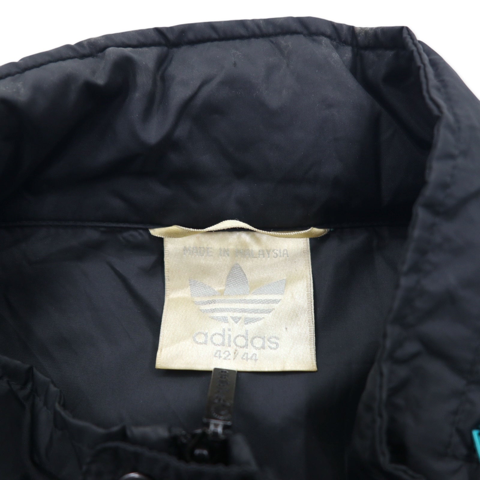 Giacca in nylon Adidas anni '90, taglia XL, colore nero, logo Trifoglio in nylon, coulisse, cappuccio ripiegabile, etichetta argentata