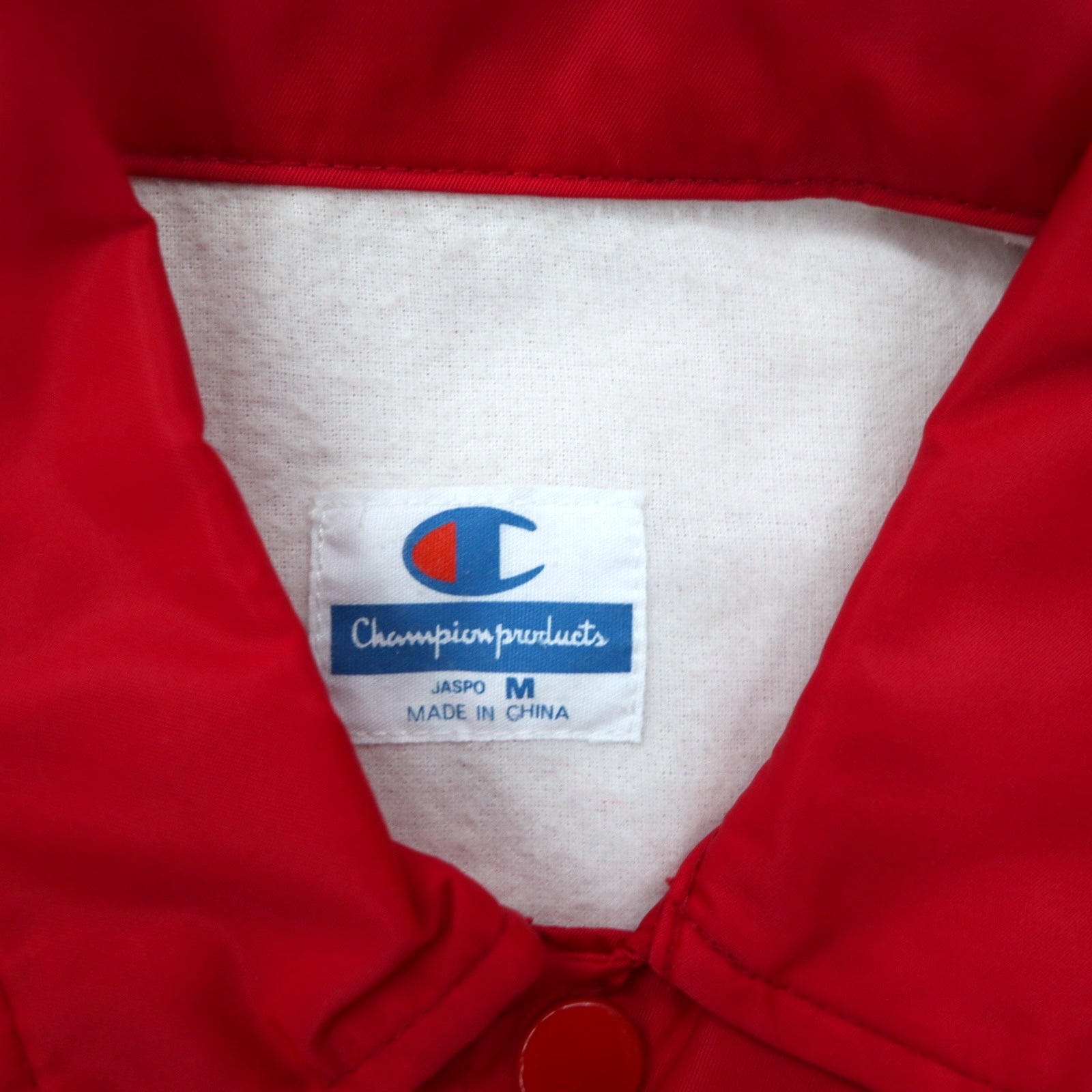 Giacca coach Champion anni '90, taglia M, rossa, in nylon, con stampa logo sul retro
